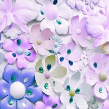 Fotobehang - Floral motif - purple composition with jewellery on light background