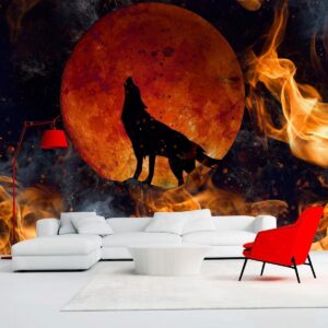 Fotobehang - Wild nature - wolf on a background of a red moon in flames of fire